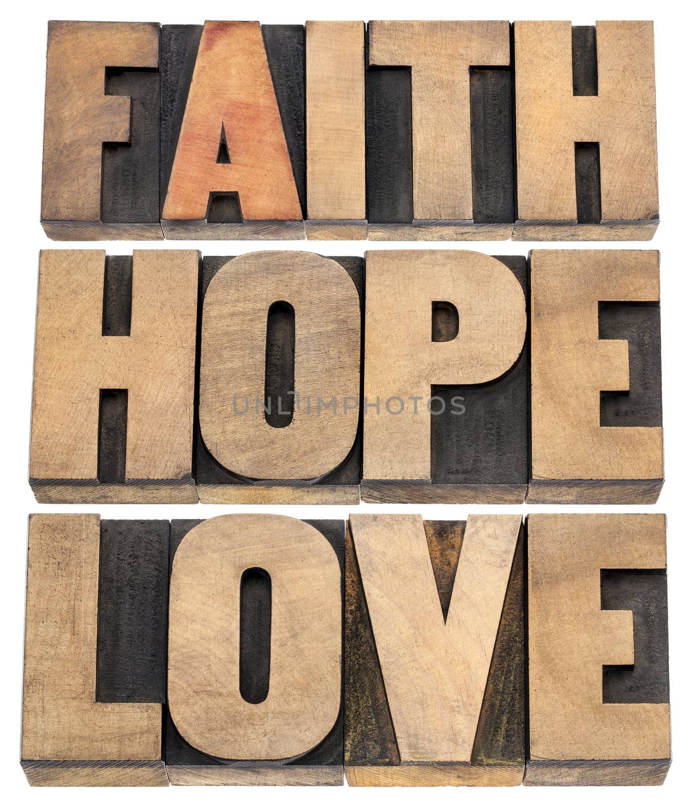faith, hope and love - a collage of isolated words in vintage letterpress wood type