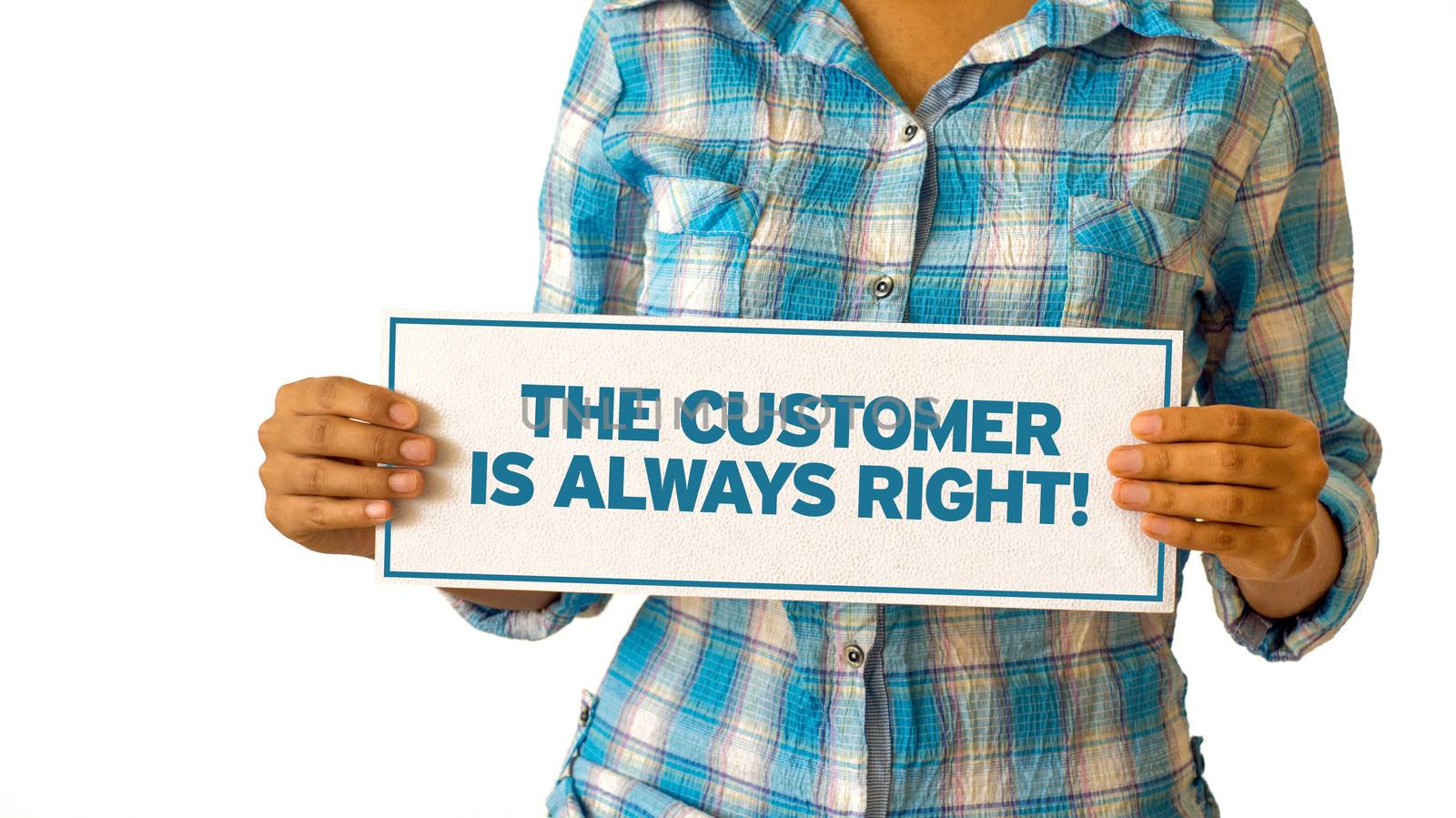 A woman holding a The customer is always right sign.