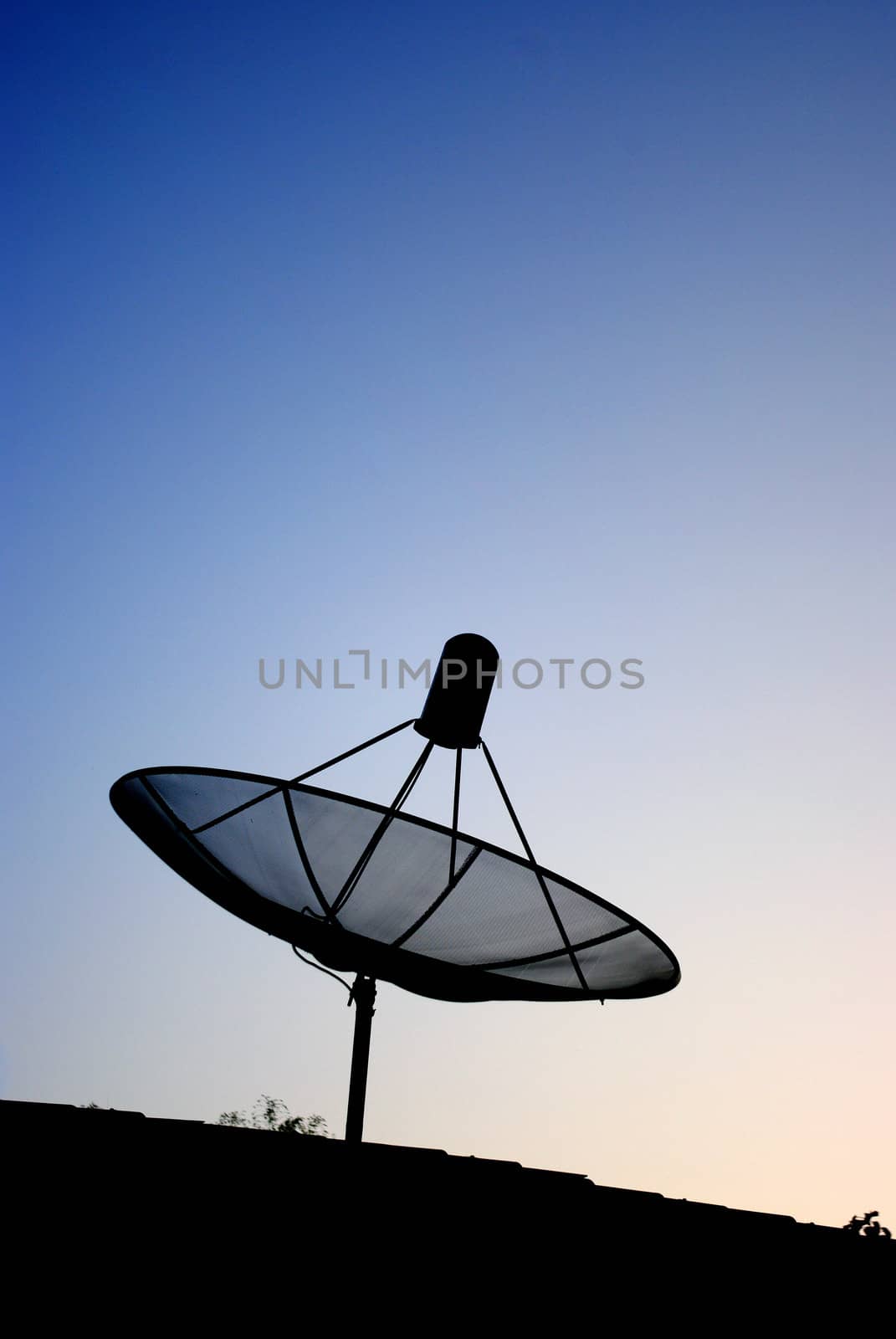 Satellite dish silhouette with blue sky background
	
