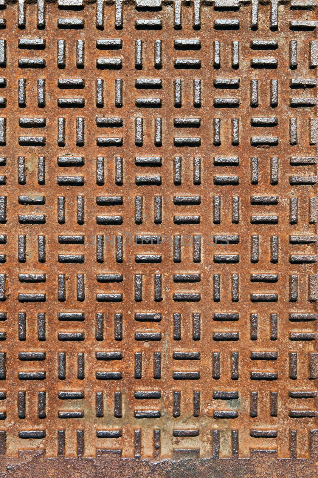Closeup of real diamond plate metal plate with rust.