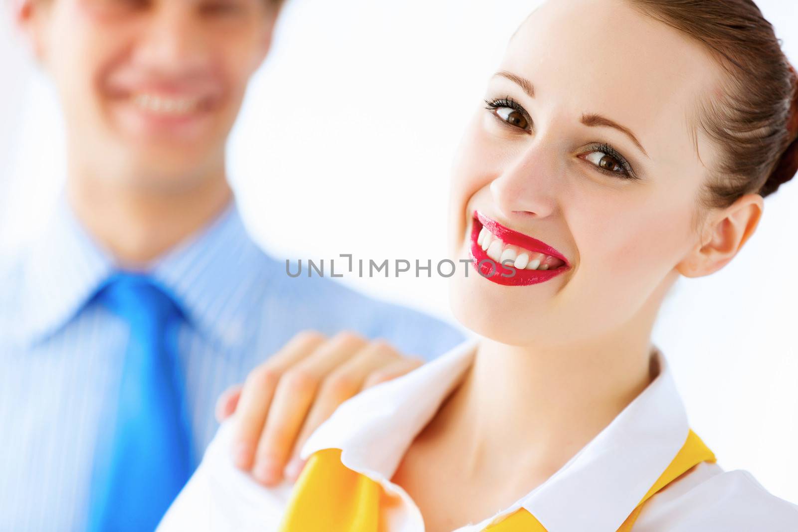 Image of businessman and businesswoman smiling joyfully