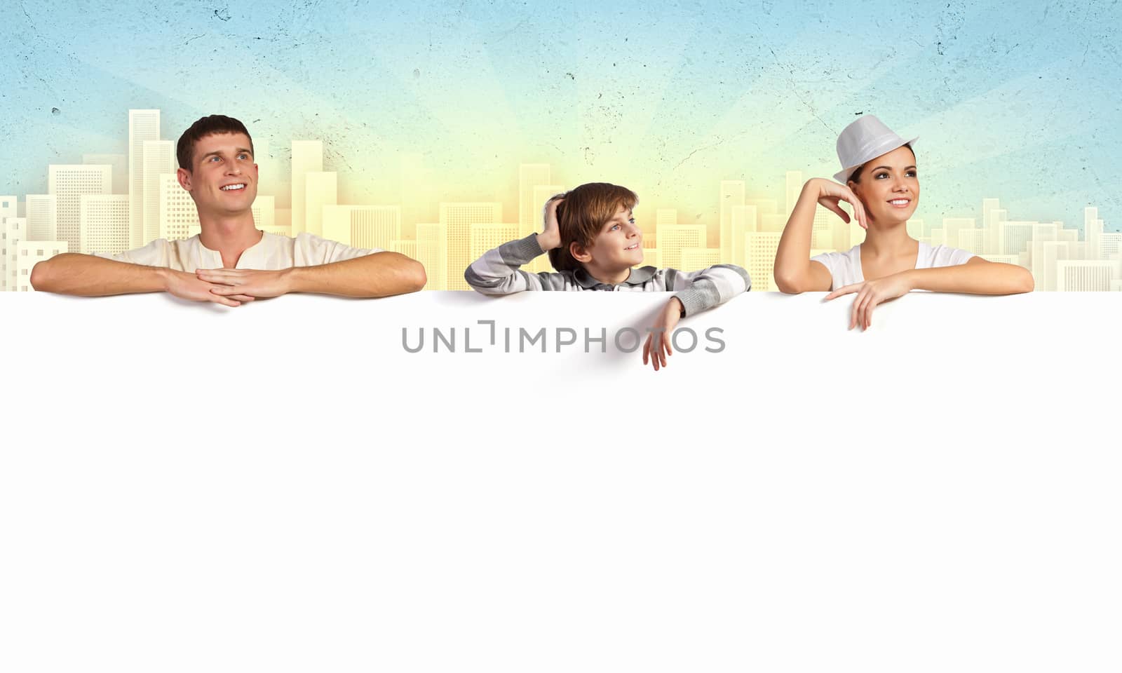 Happy young family with blank banner. Place for text