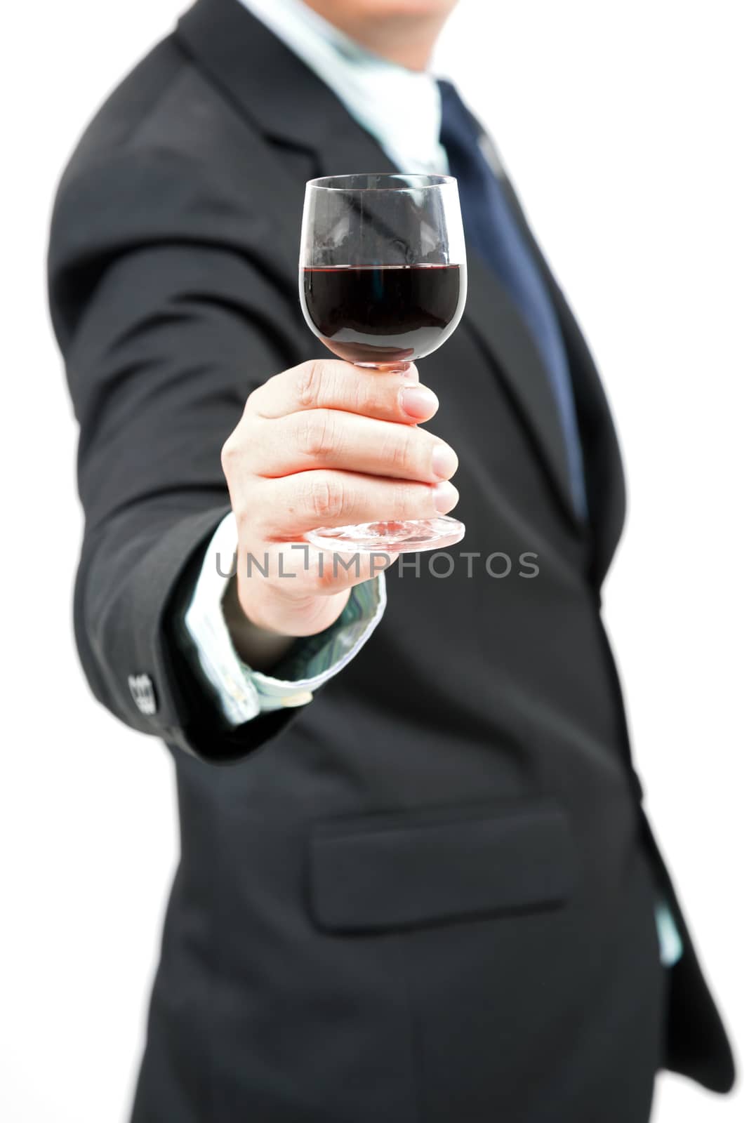 businessman with glass of wine (selective focus at glass)