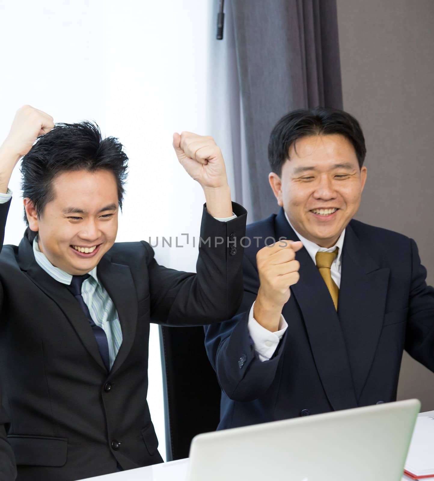 Businessmen celebrate their business success
