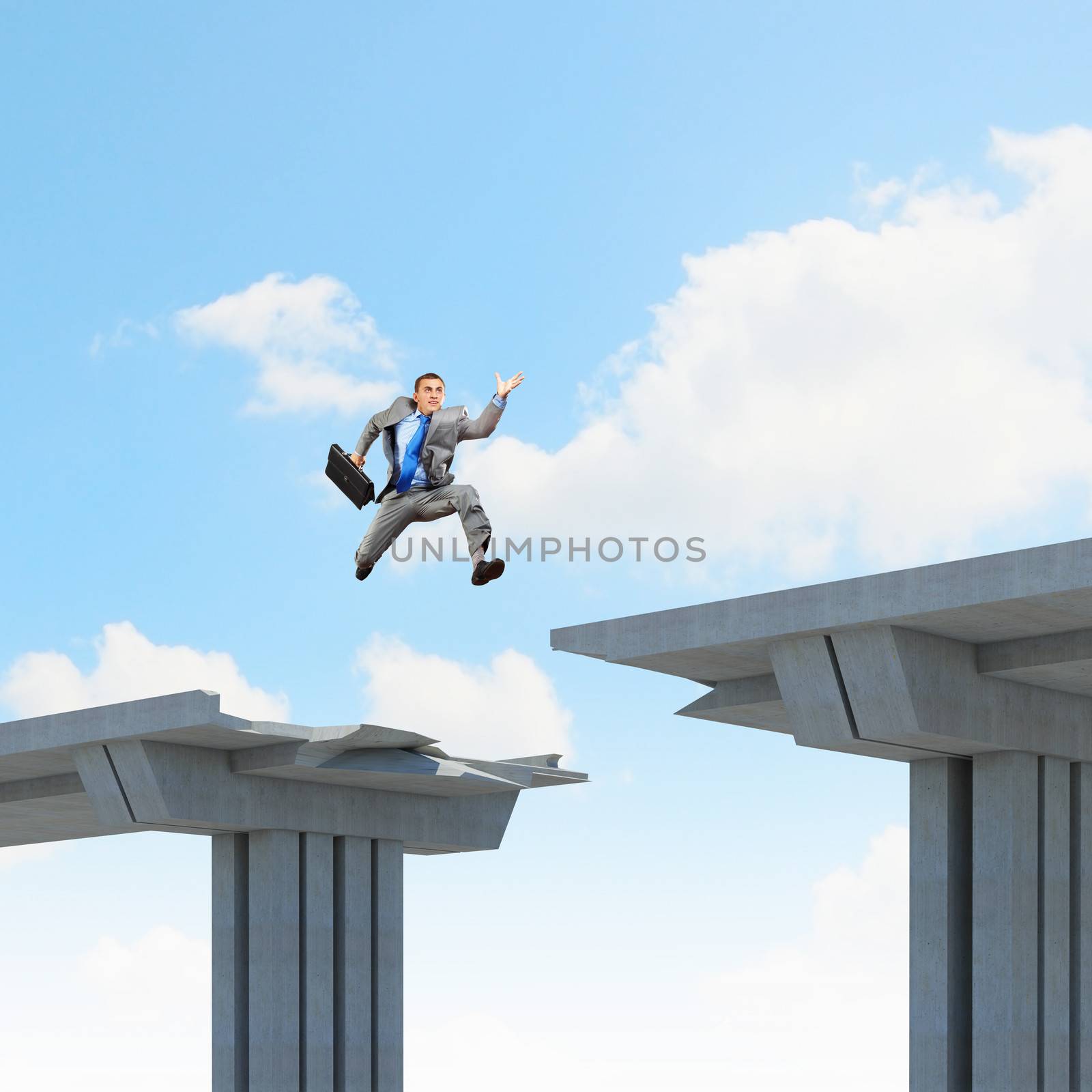 Businessman jumping over a gap in the bridge as a symbol of bridge