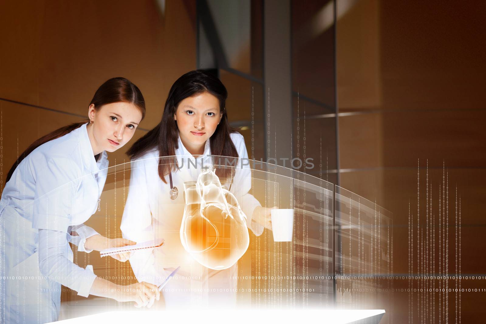 Image of two attractive women cardiologist examining virtual heart