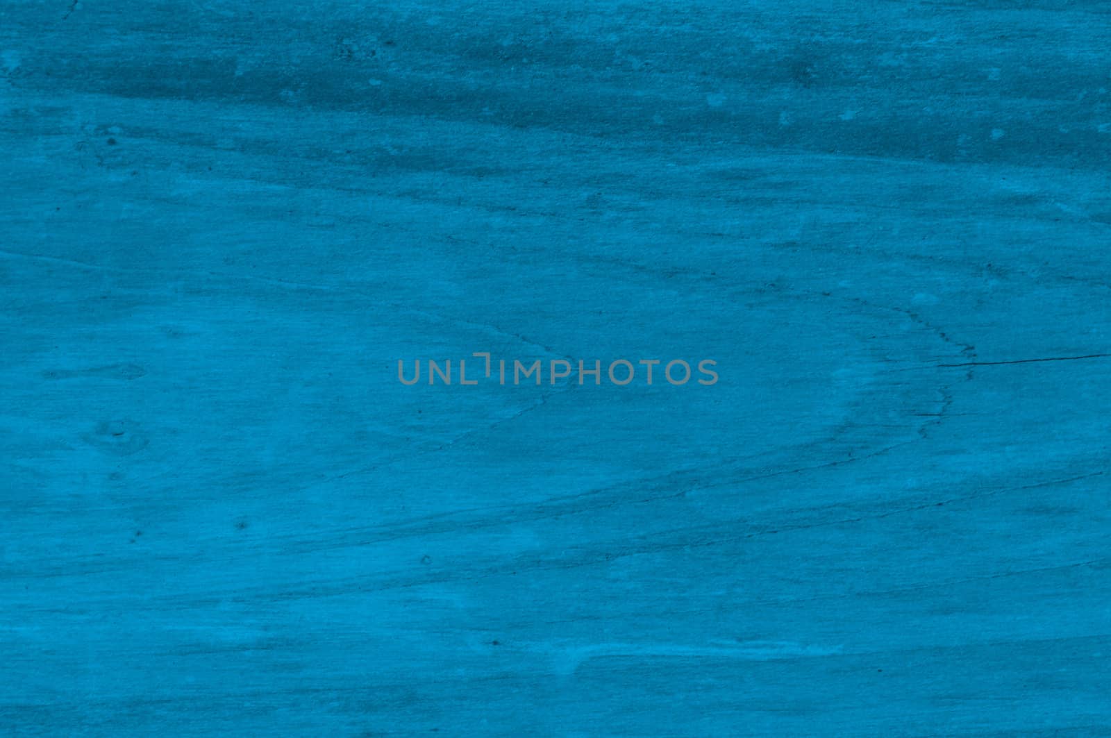 a blue, distressed and textured background of wood with knots
