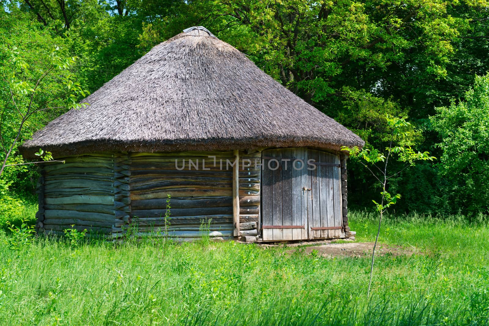 Typical traditional village antique wooden storehouse or barn