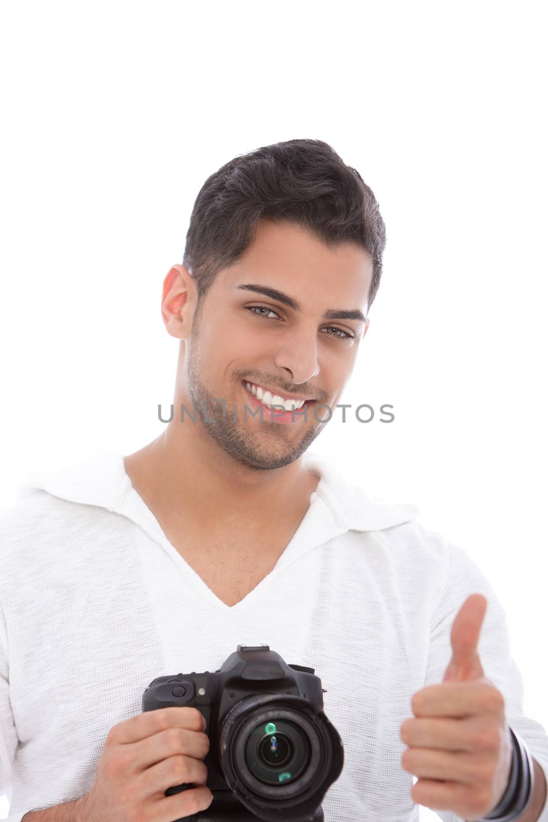 Handsome young male photographer giving a thumbs up to show that he has successfully captured the shot