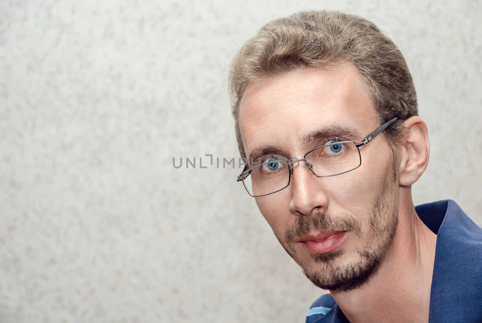 Young handsome man with glasses and lots of copy space.
