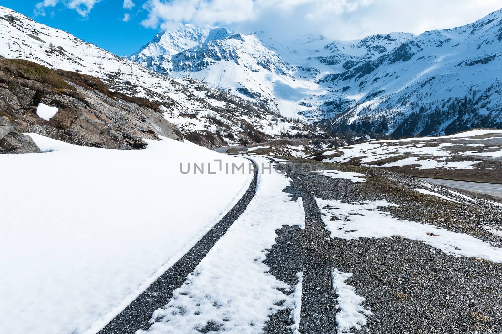 Marks of wheels car in the snow on the Simplon Pass, Italy