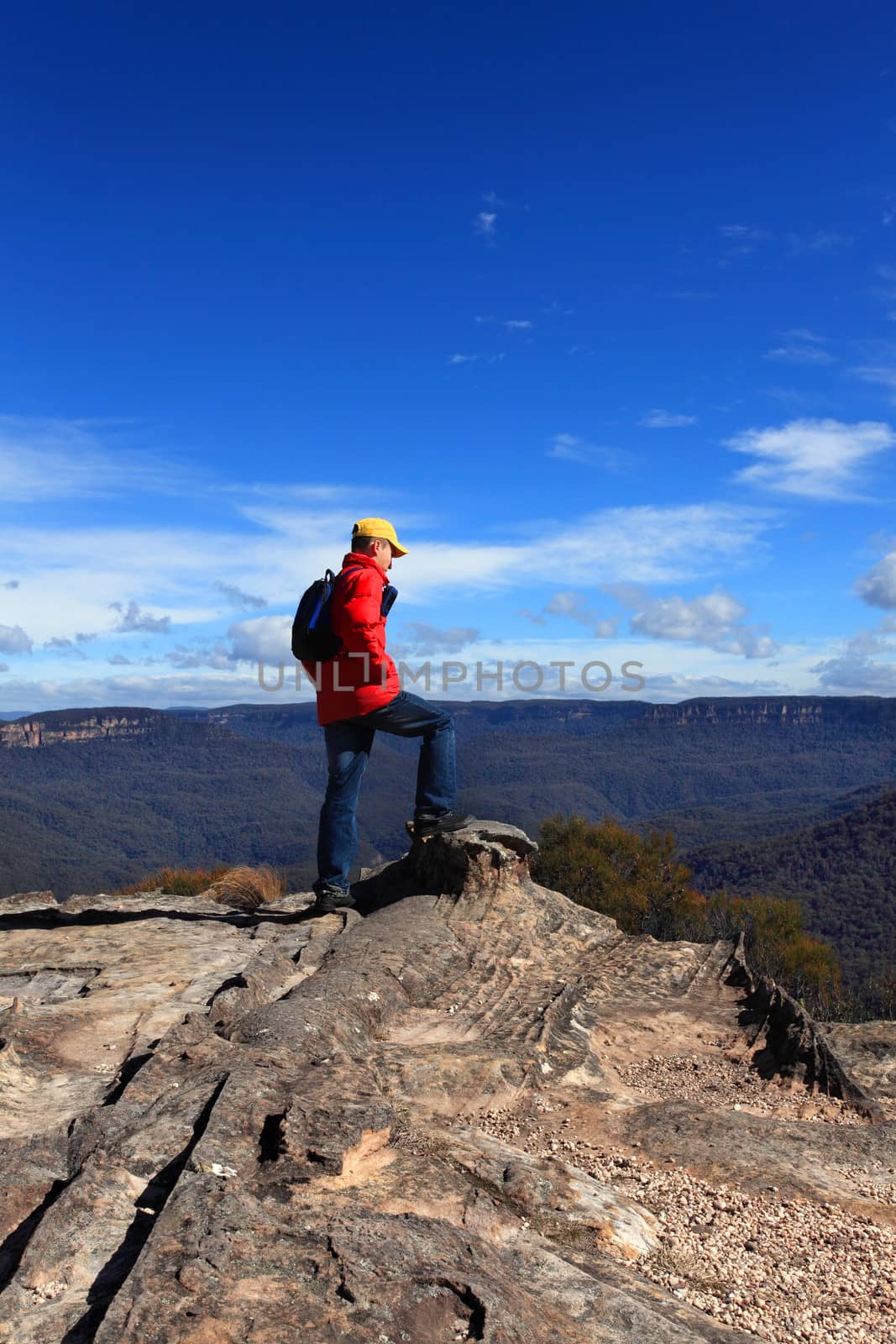 Hiker admiring mountain views by lovleah