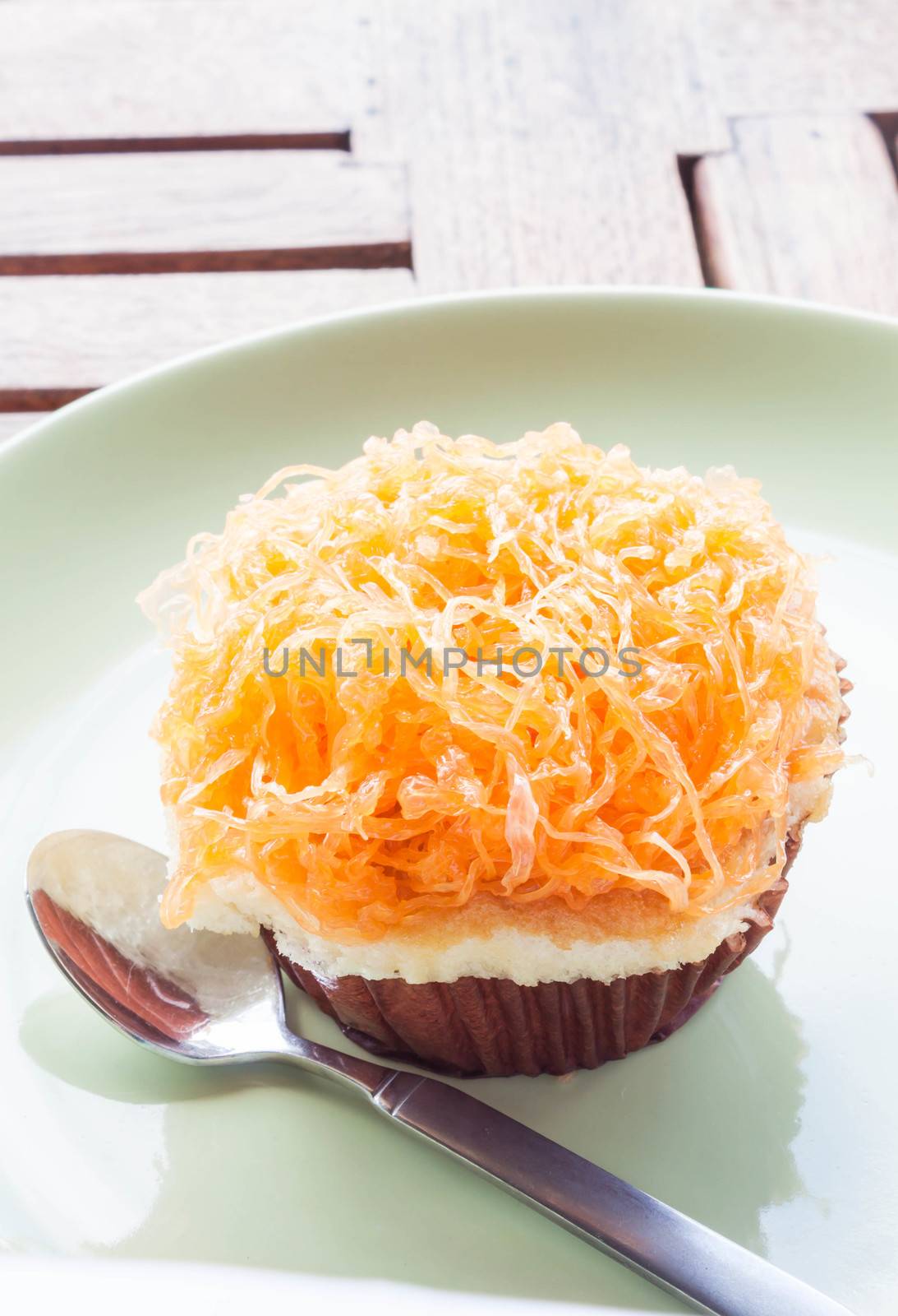 Gold egg yolk thread cup cake up close by punsayaporn