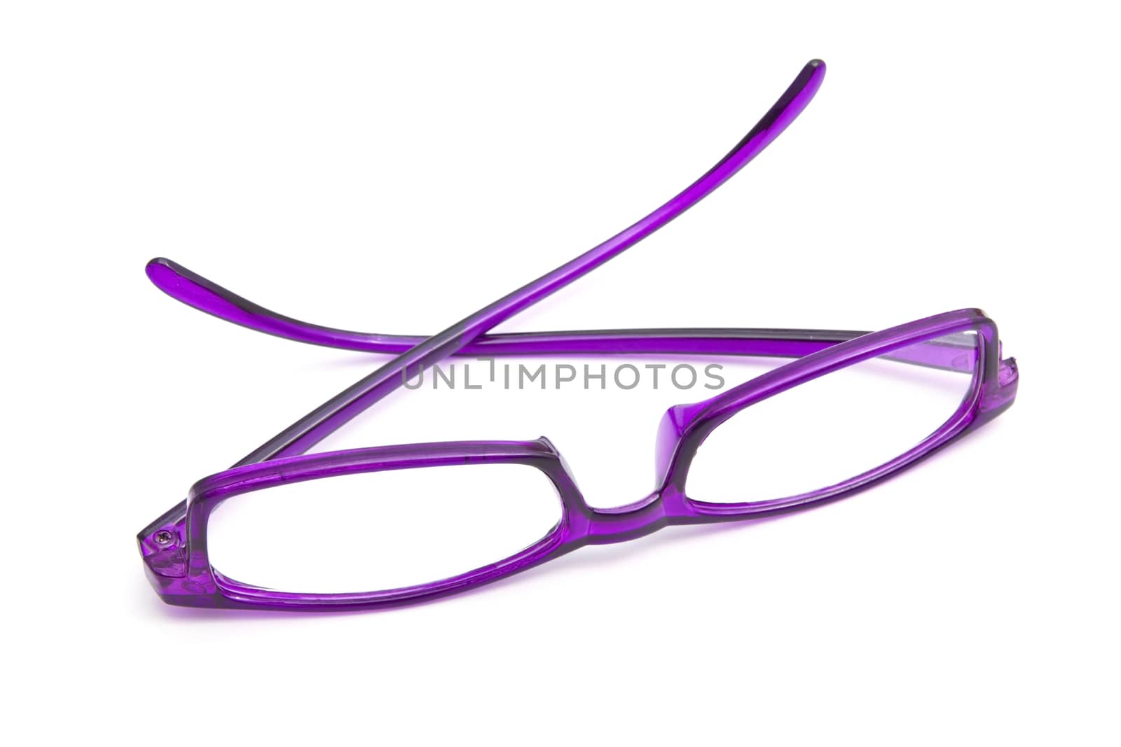 Beautiful purple glasses closeup on white background 