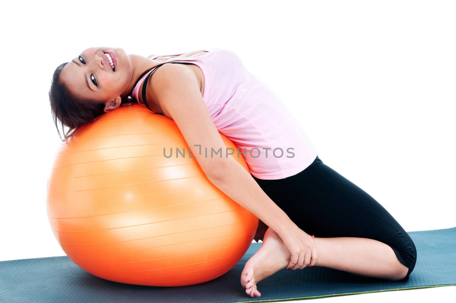 Portrait of a fitness woman working out on balance ball