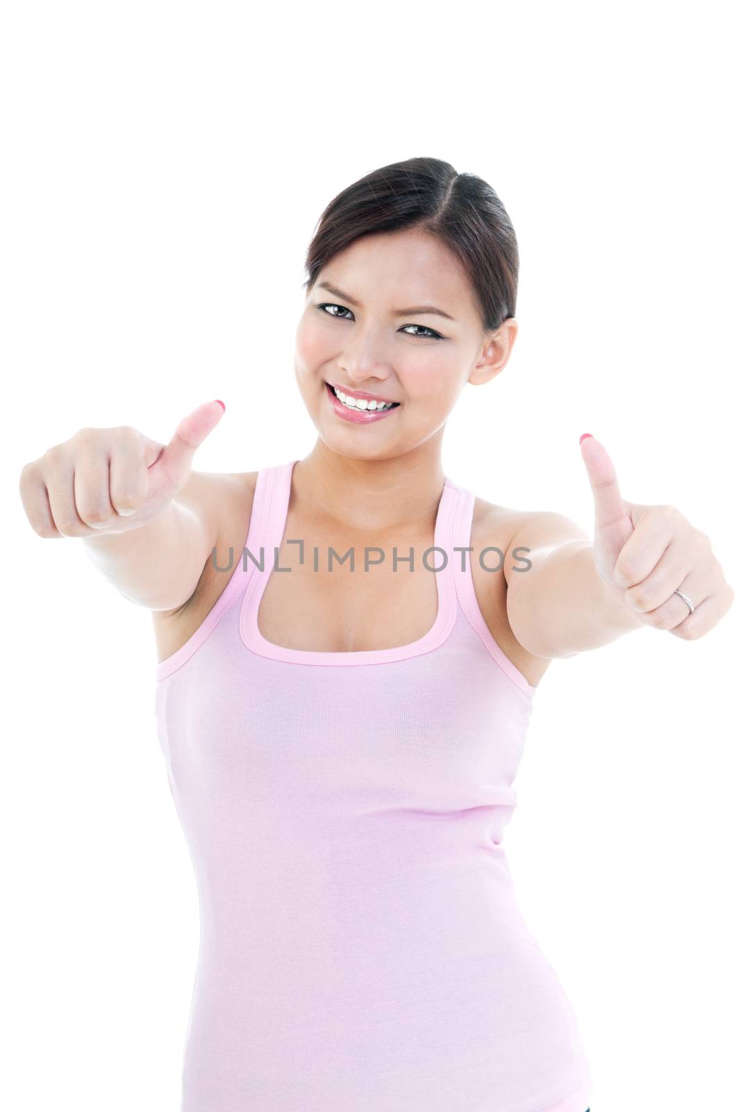 Beautiful woman giving two thumbs up over white background.