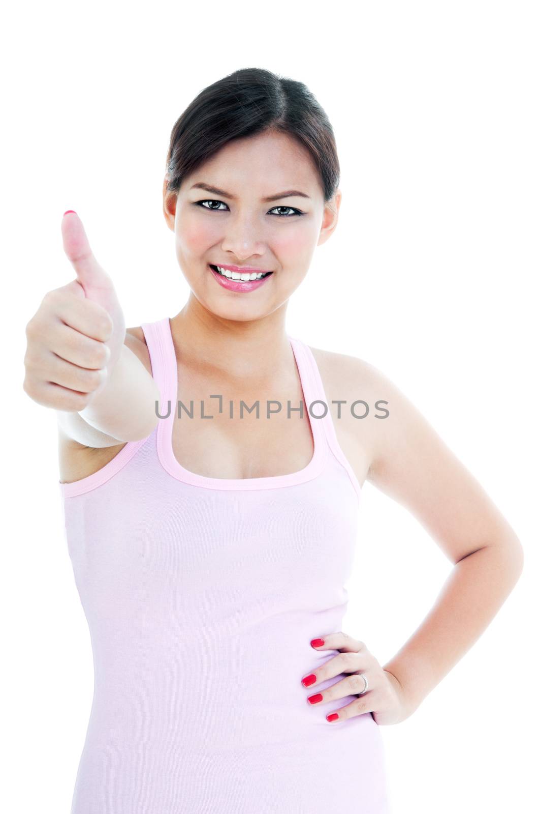 Portrait of a healthy young woman giving thumb up gesture over white background.