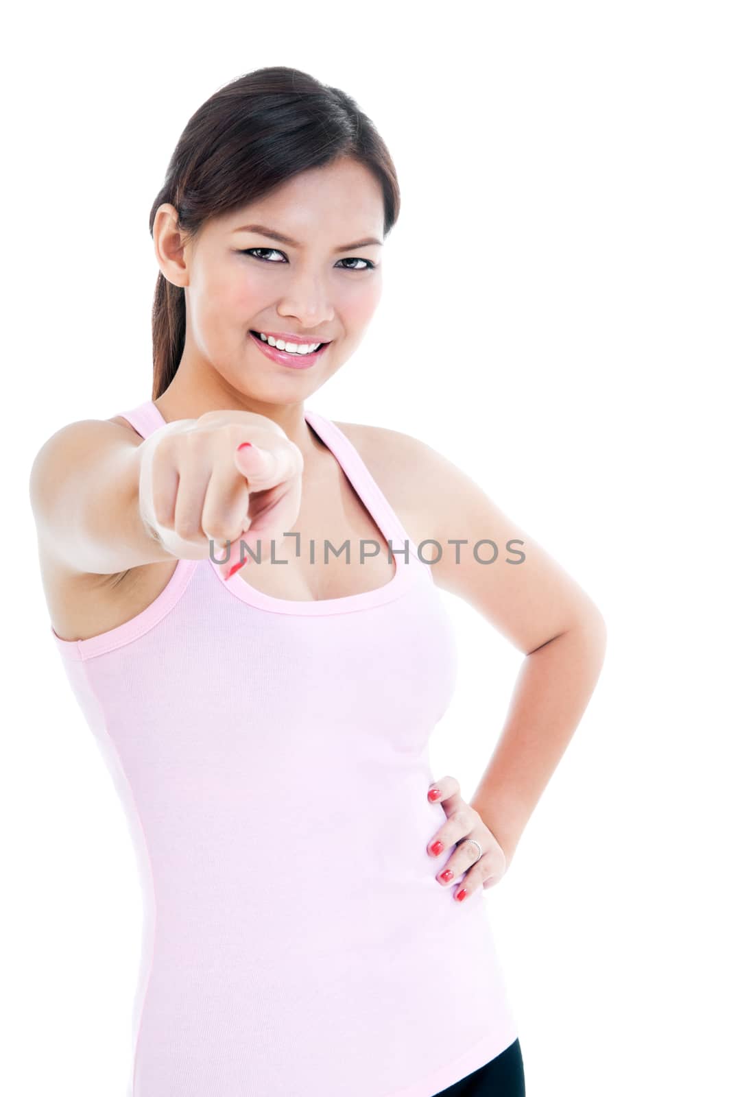 Portrait of a healthy young woman pointing, isolated on white.