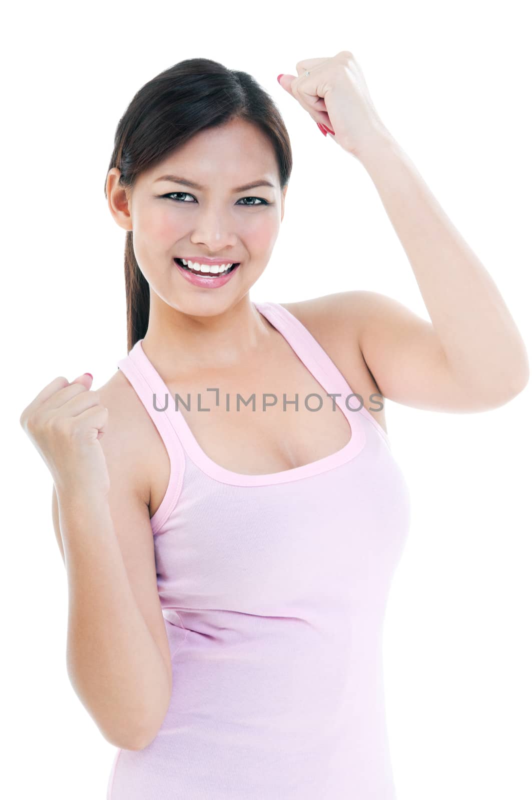 Portrait of an excited young woman celebrating success, isolated on white.