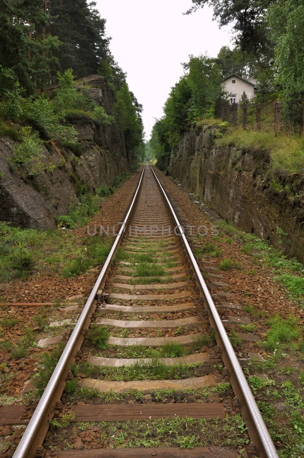 Railway tracks and gravel leading into the infinite distance