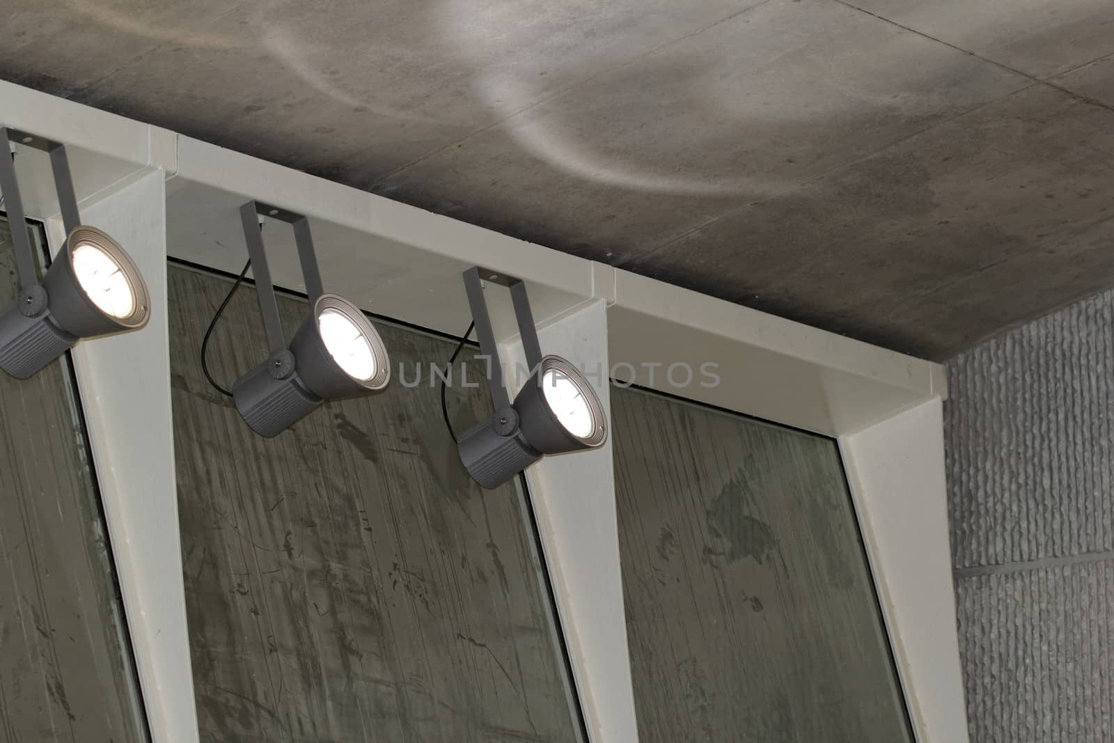 industrial lights on the wall inside a building
