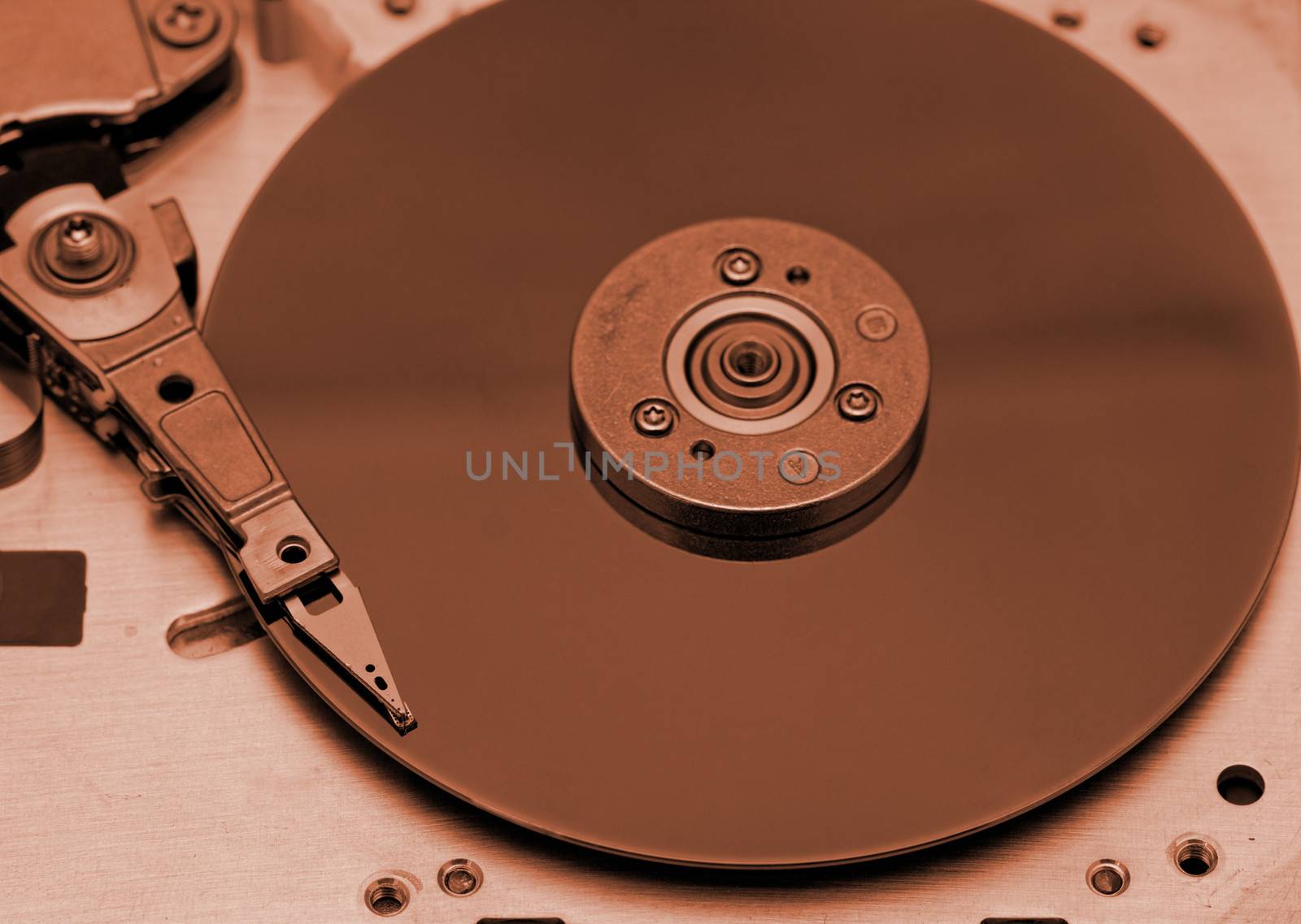 Open computer hard drive on white background with rusty color (HDD, Winchester)
