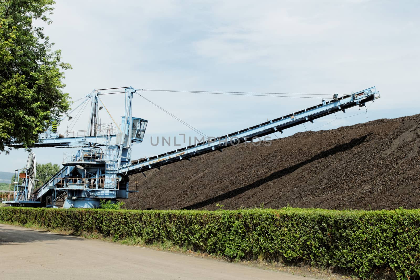 Coal mining in an open pit with huge industrial machine