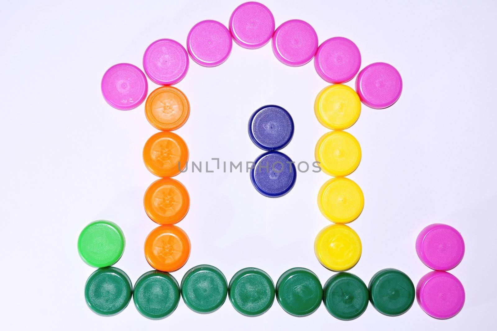 Many different plastic caps forming a color house