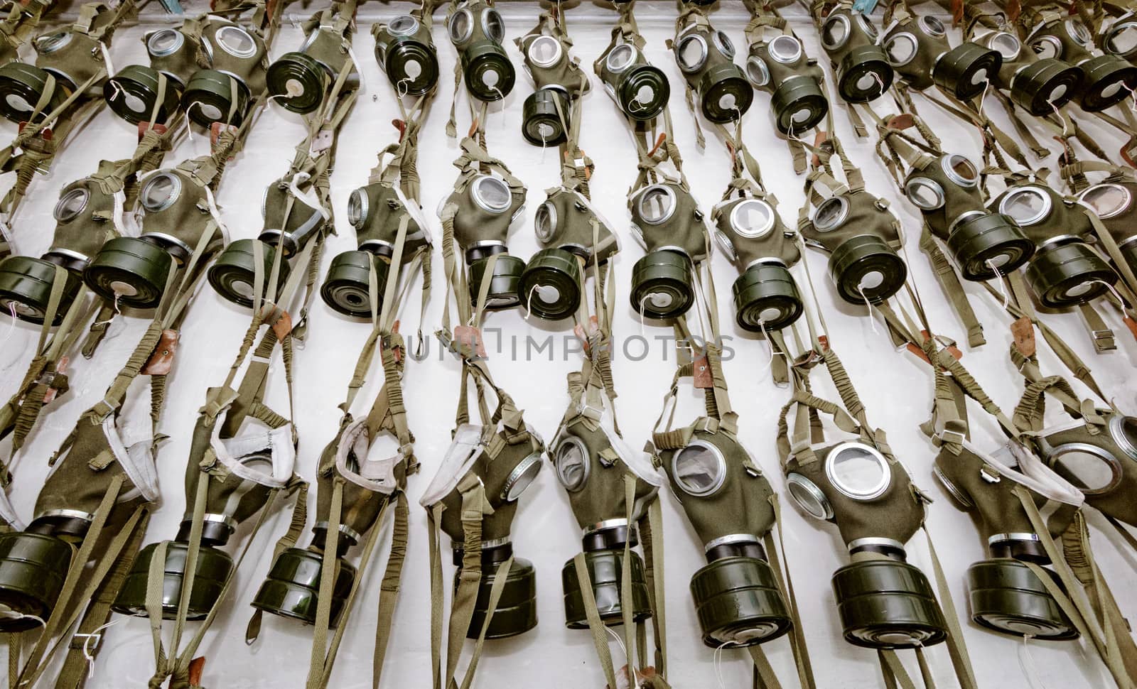 old military gas masks hanging on each other