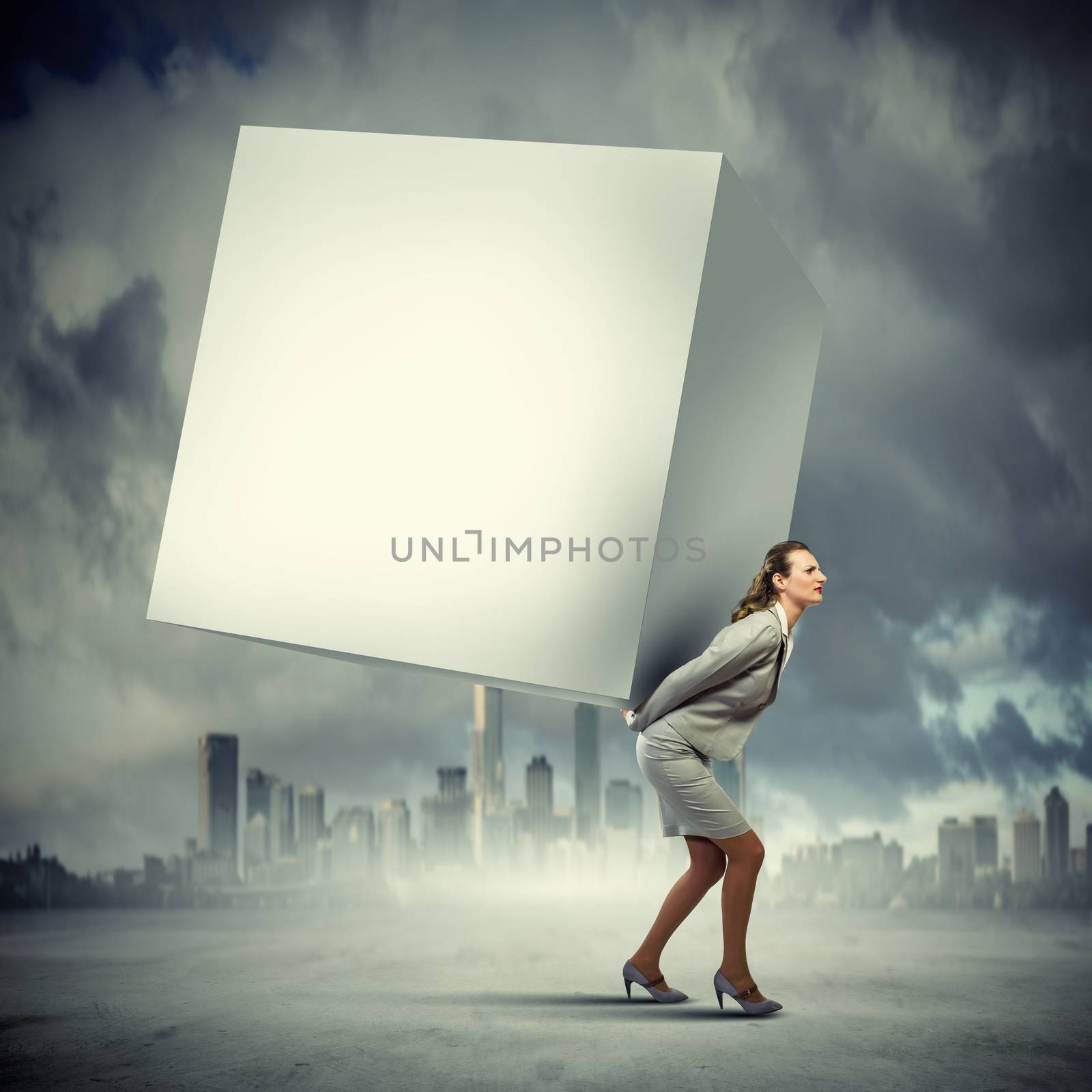 Image of businesswoman carrying big white cube on her back. Place for text