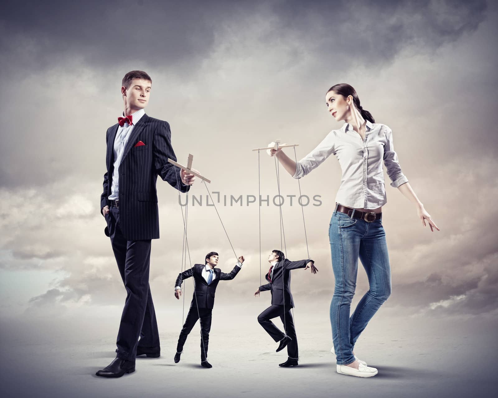 Image of man and woman with marionette puppets