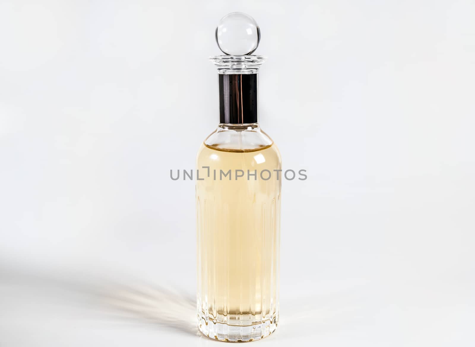 Bottle of female perfume on isolated background