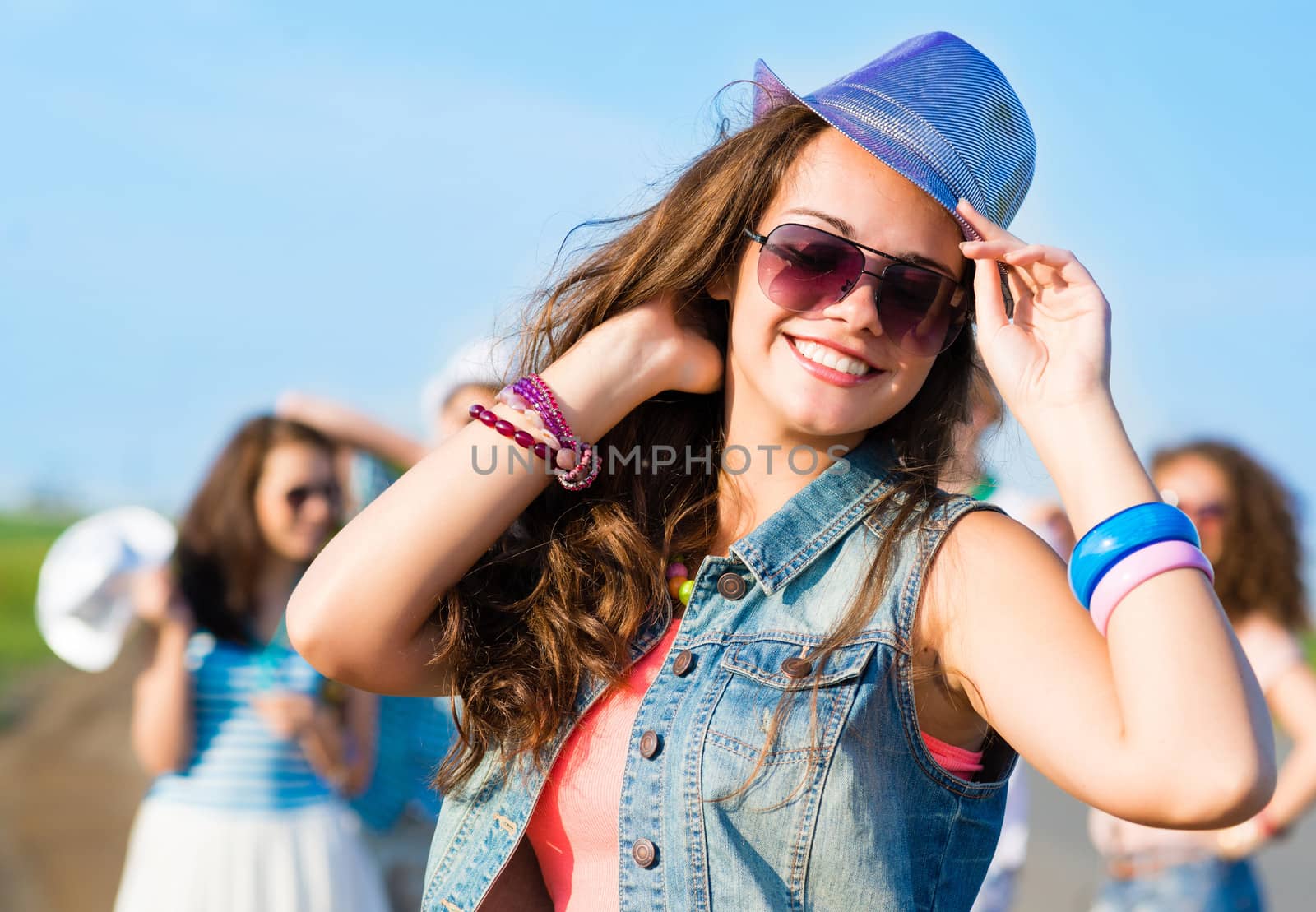 stylish young woman in sunglasses by adam121