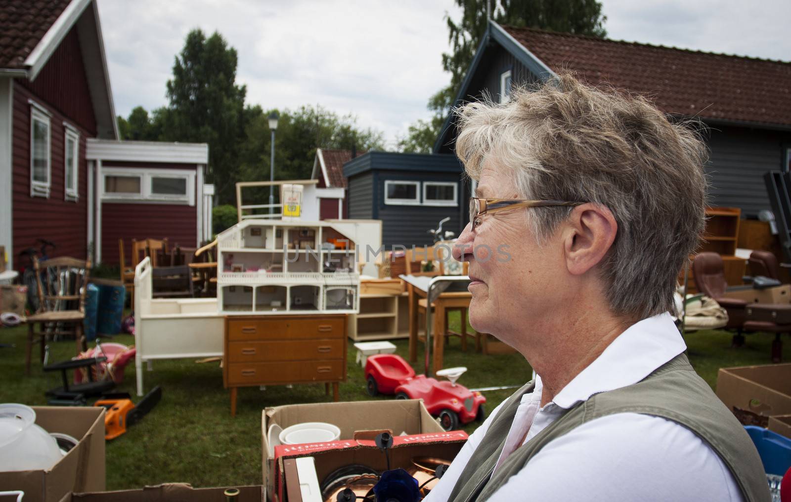 An old woman at a yard sale