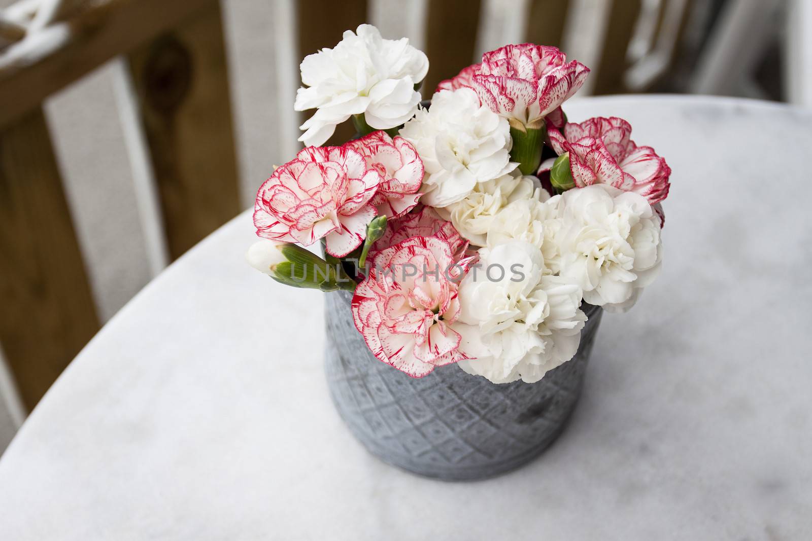 A small bunch of flowers in a vase on a table