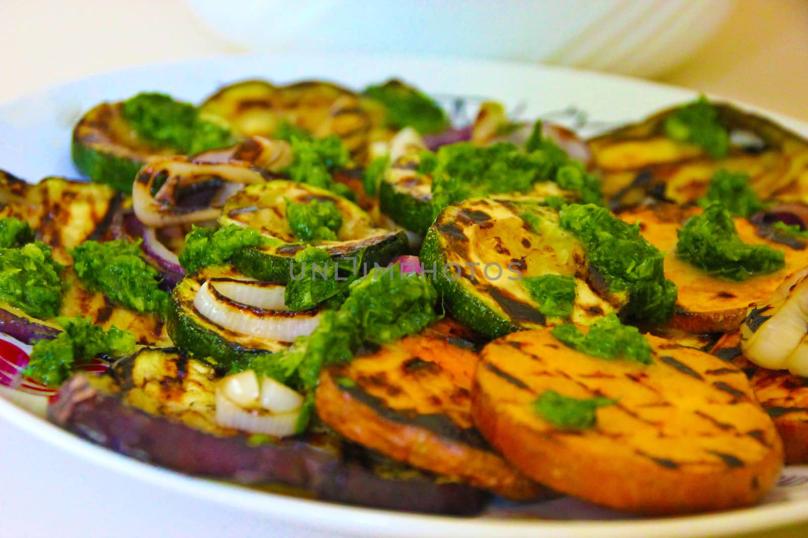 Grilled red potatoes, onions,courgettes and aubergines covered with coriander-basil pesto and olive oil. A popular Mediterranean dish.