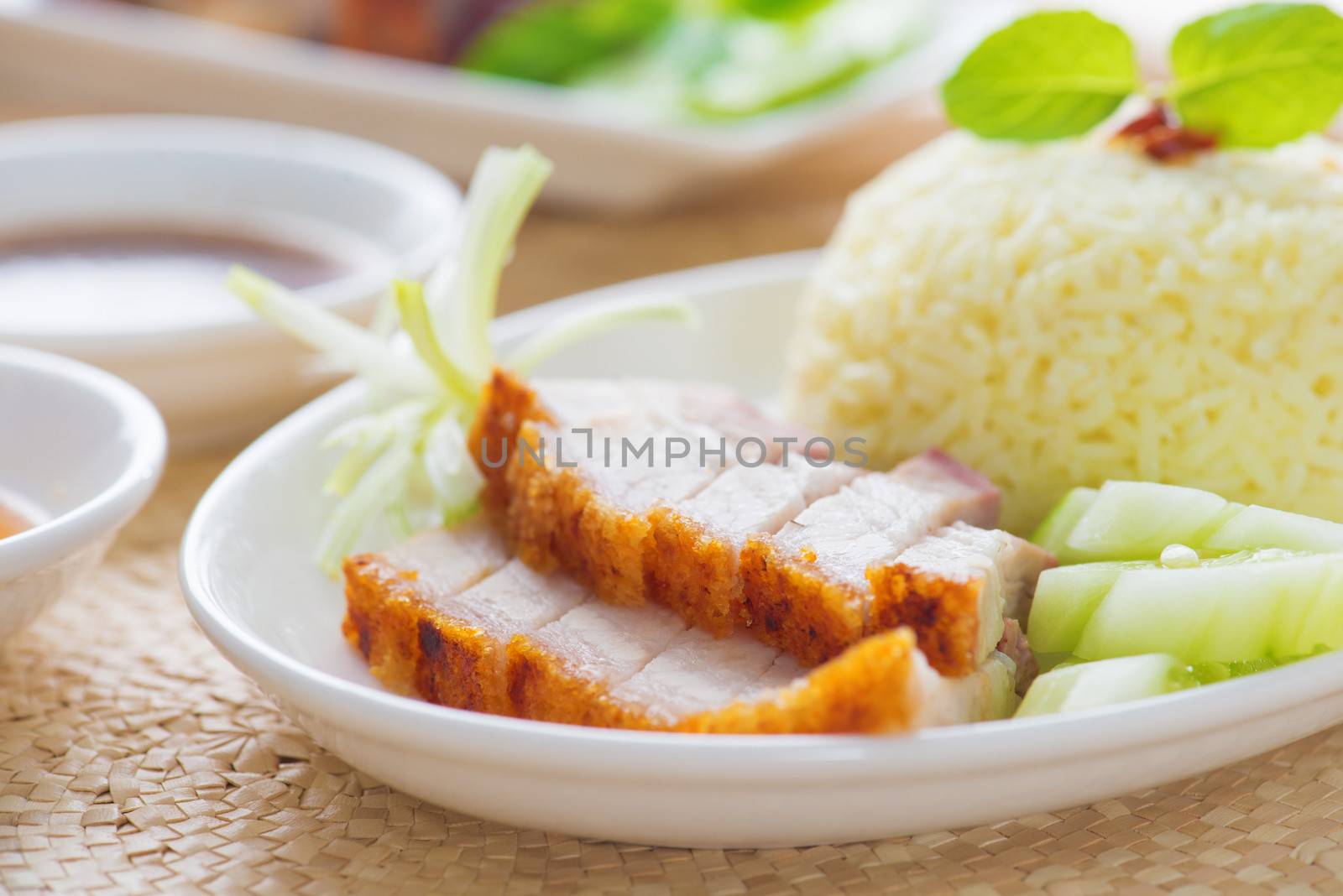Siu Yuk or crispy roasted belly pork Chinese style, served with steamed rice. Singapore Chinese cuisines.