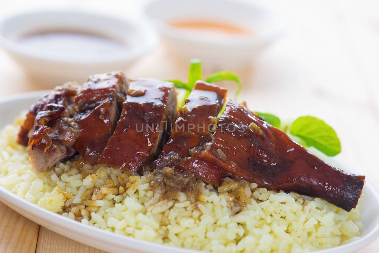 Peking duck or Roasted duck, Chinese style, served with steamed rice on dining table. Hong Kong cuisine.