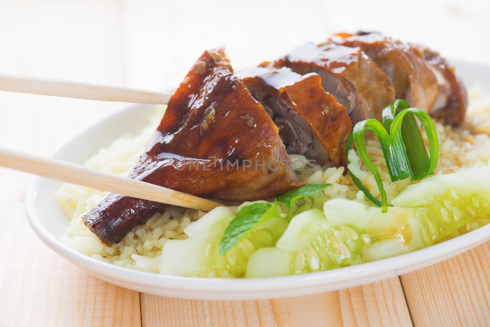 Roasted duck, Chinese style, served with steamed rice on dining table. Malaysia cuisine.