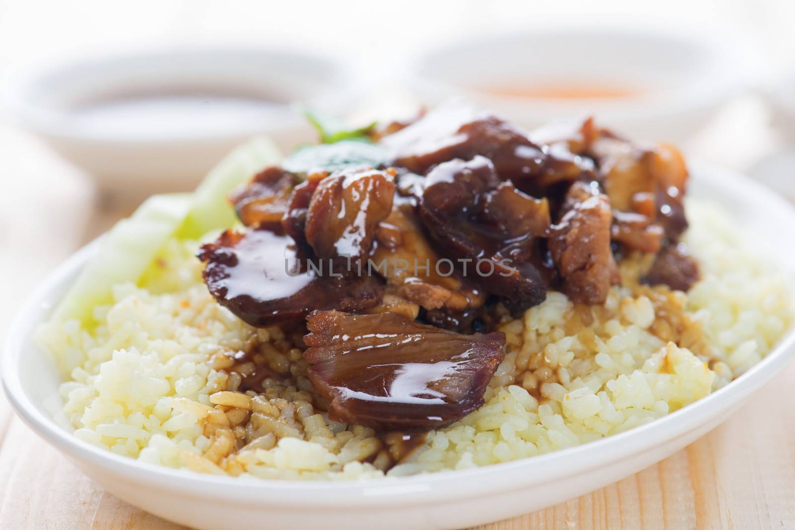 Slices of traditional Chinese marinated barbecue pork on dining table. Bbq pork Char Siew Rice Singapore cuisine.