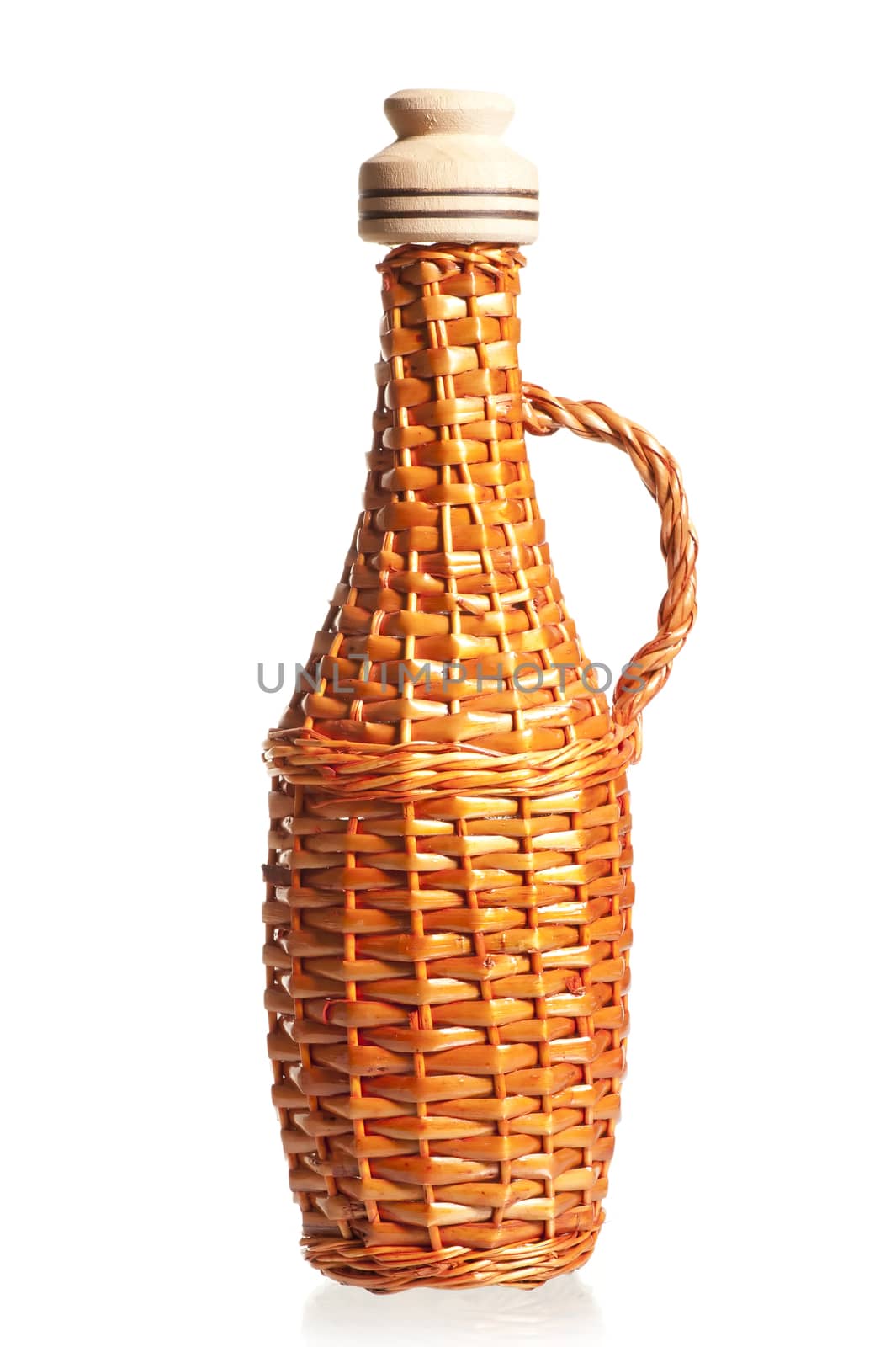 straw wicker bottle for oil with cork on a white background