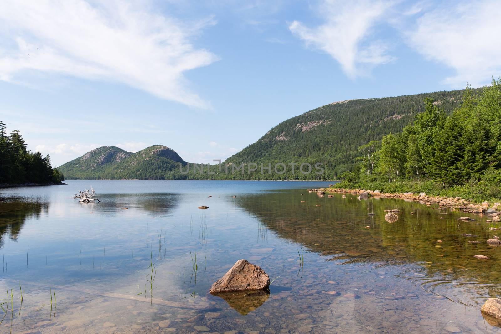 This is a view of Jordan Pond in Acadia National Park. In the background are two mountains called the Bubbles.