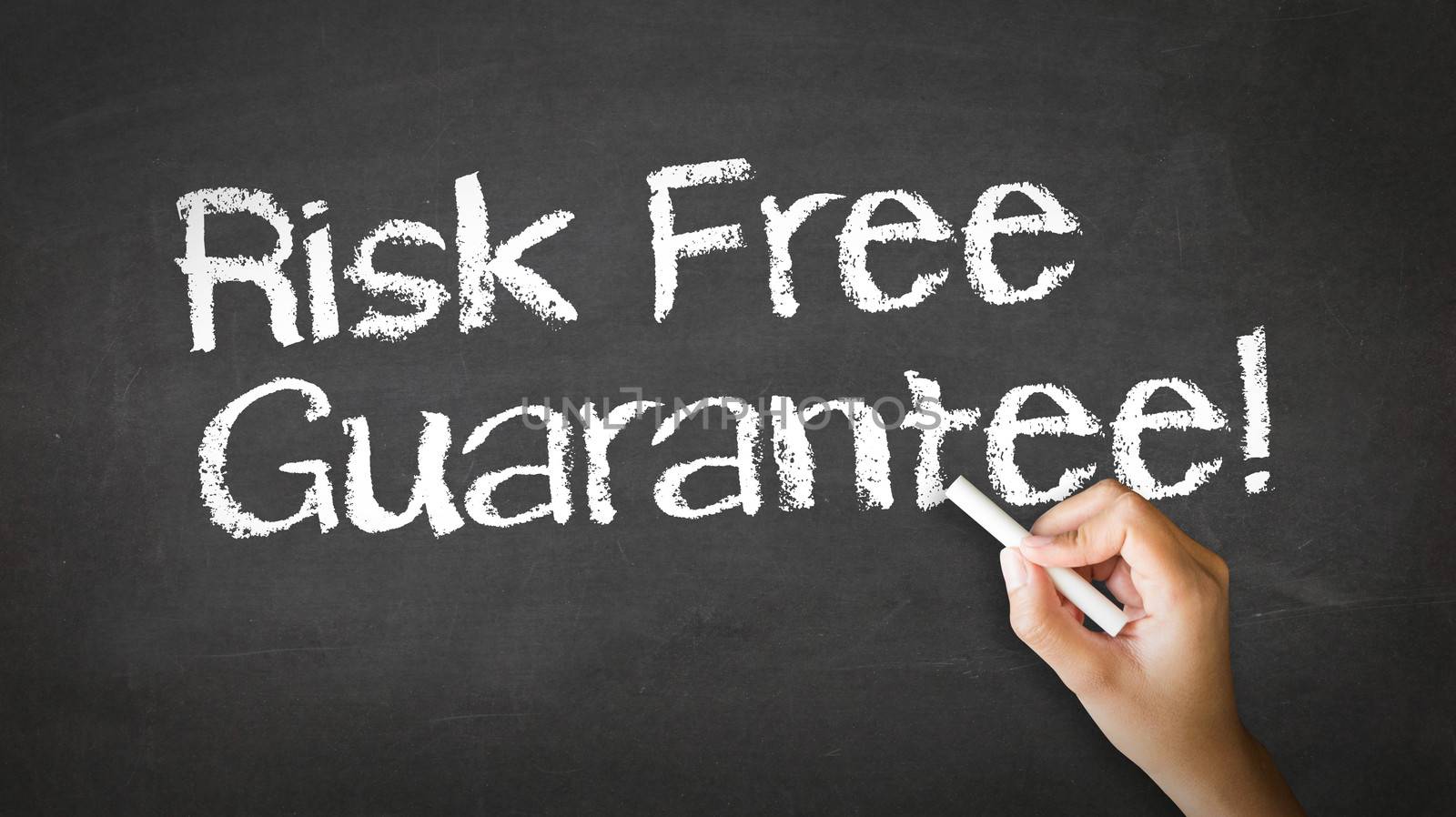 A person drawing and pointing at a Risk Free Guarantee Chalk Illustration