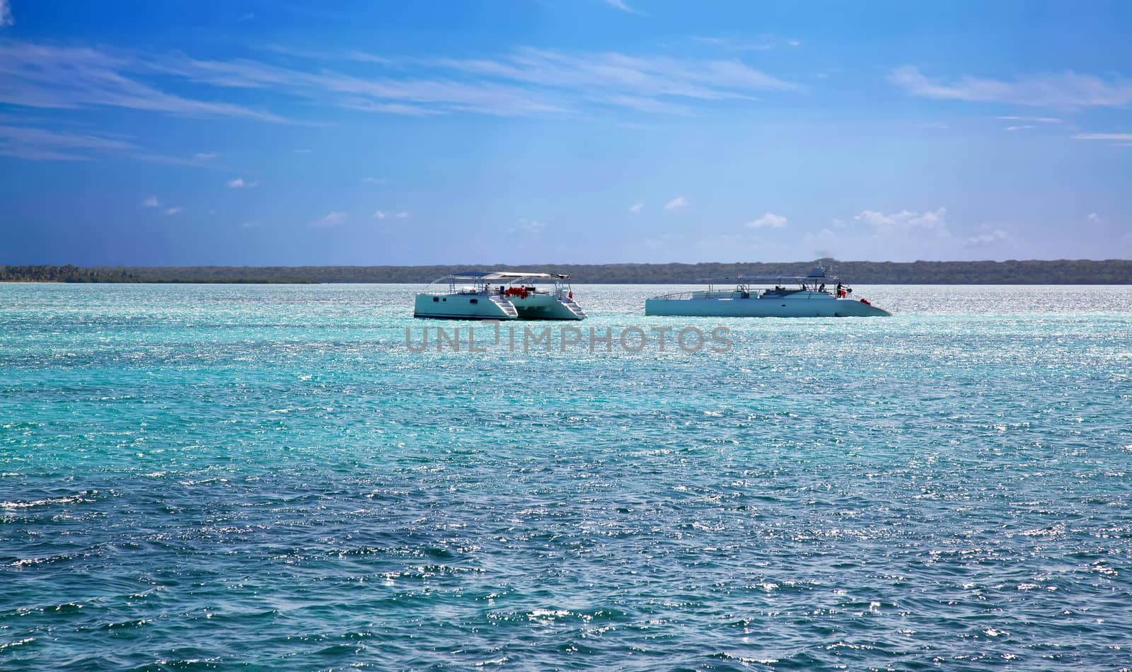 Beautiful ocean with blue sky and catamarans