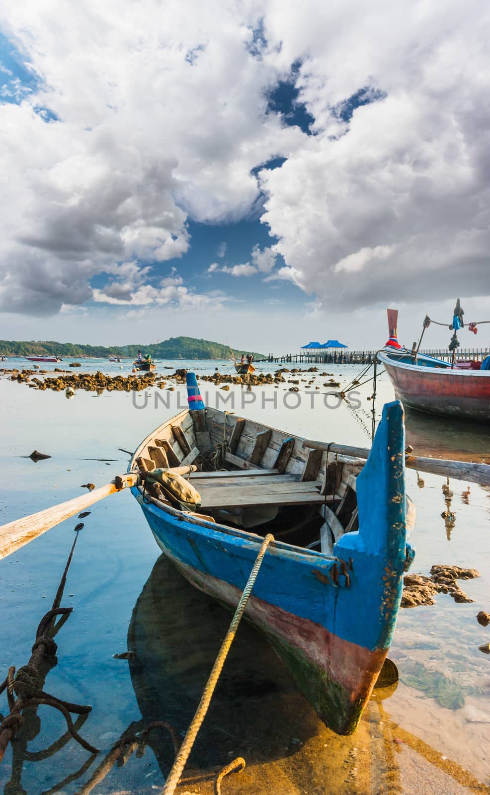 Fishing boats on the sea shore in Thailand by oleg_zhukov