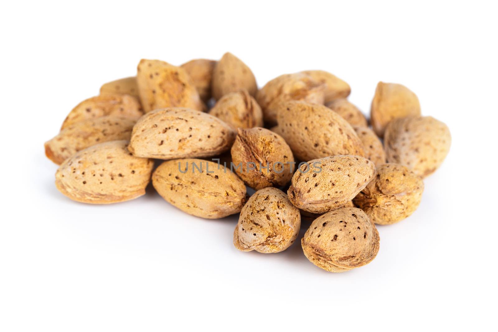 Almond nuts on white background. Macro shot