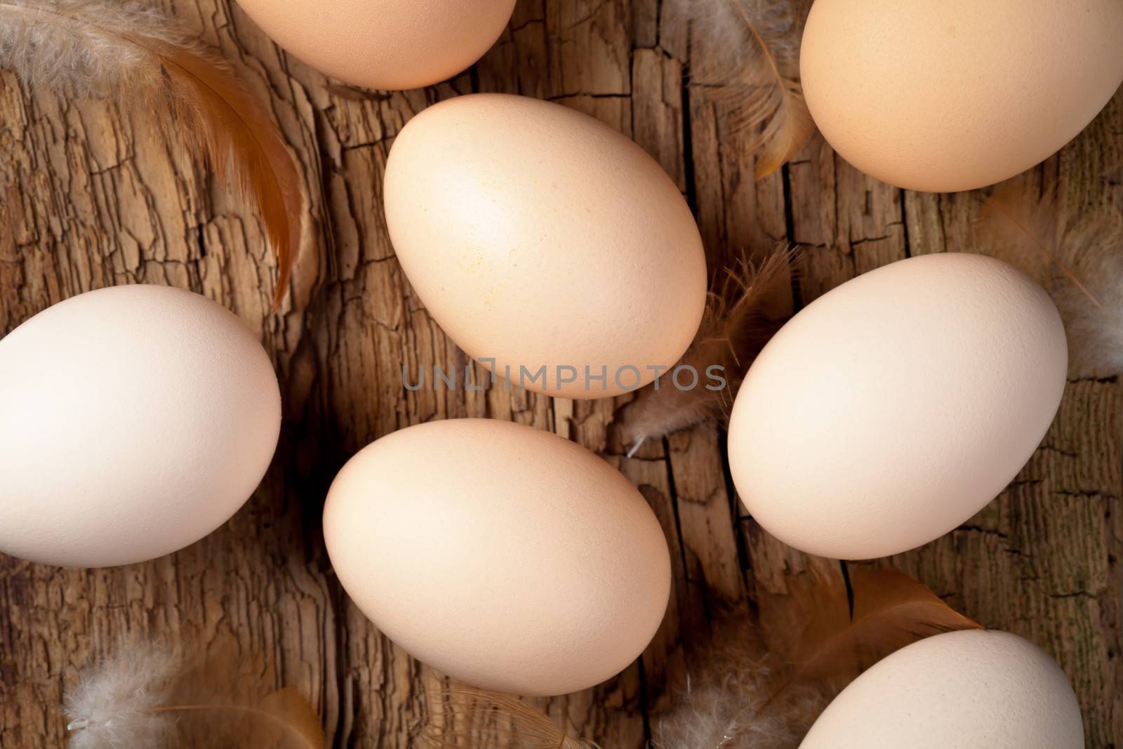 Eggs on wooden table background. Top view