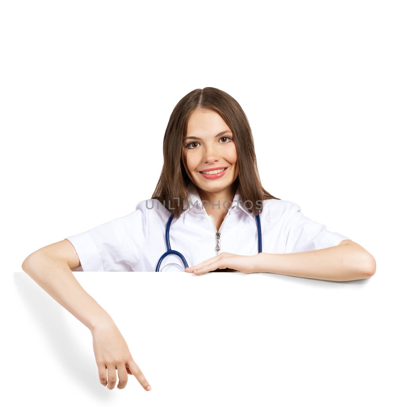 Young attractive female doctor put her hands on the blank banner, points at a place for text