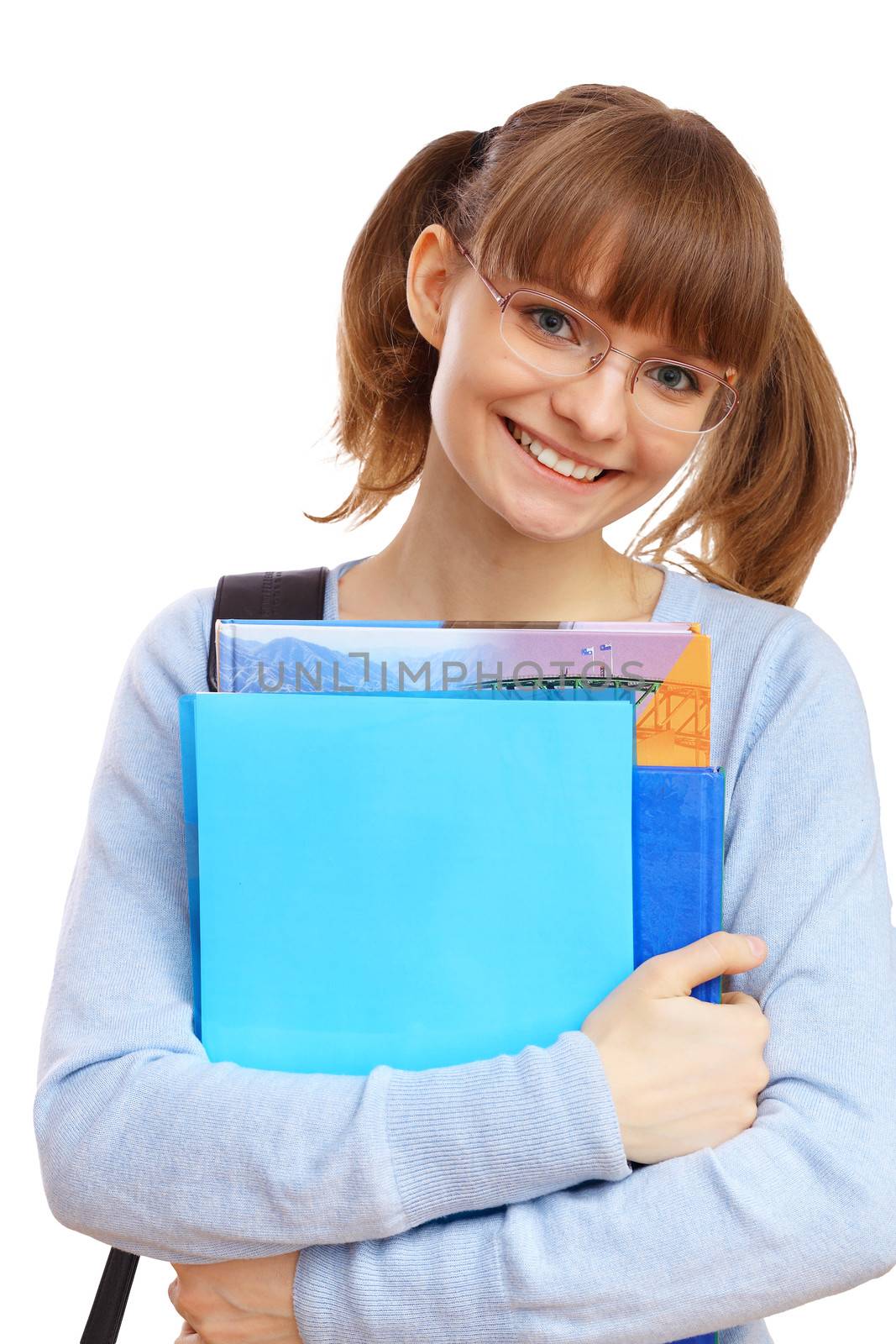 Happy smiling student standing and holding books