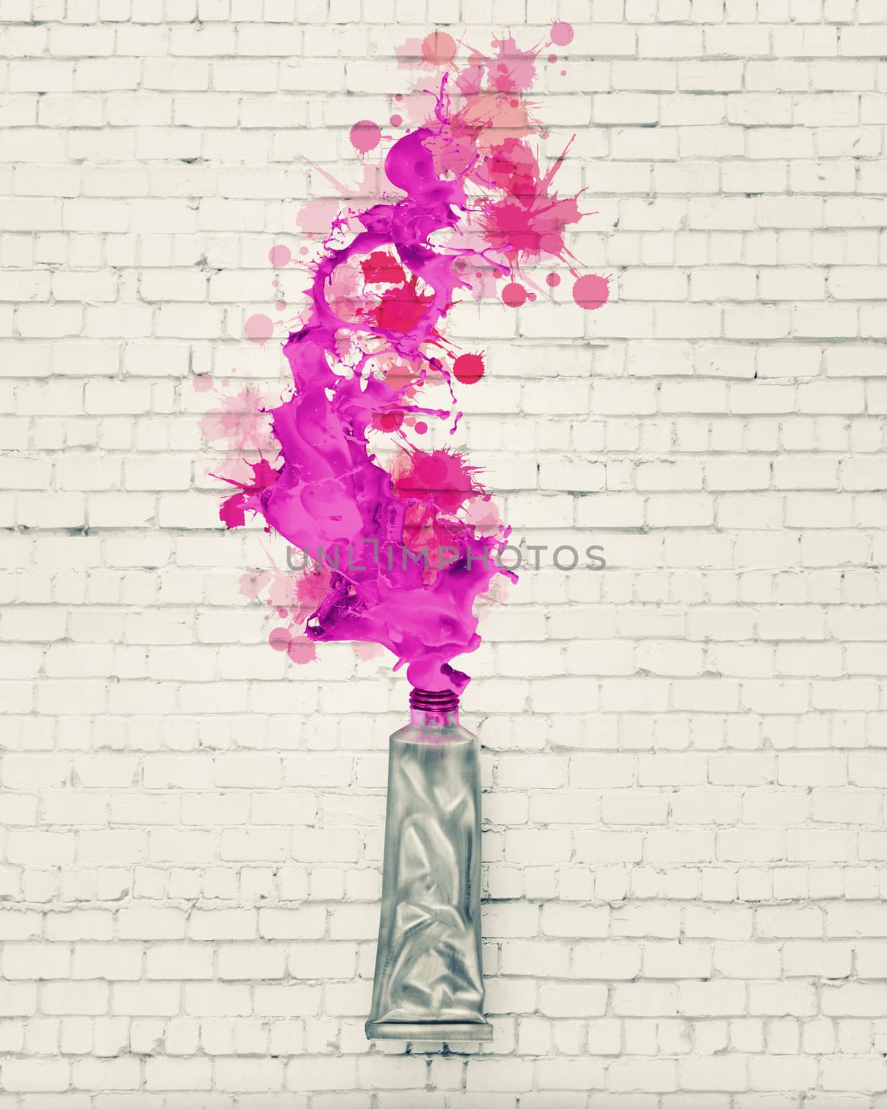 Image of paint tube with color splashes